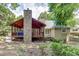 House exterior with stone fireplace and deck at 2000 Shadwell Way, Lawrenceville, GA 30043