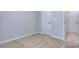 Bright bedroom with neutral carpeting and doors at 6214 Ripple Way # 91, South Fulton, GA 30349