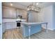 Modern kitchen with gray cabinets and large island at 6214 Ripple Way # 91, South Fulton, GA 30349