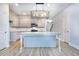 Kitchen island with granite countertop and gray shaker cabinets at 6214 Ripple Way # 91, South Fulton, GA 30349