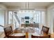 Dining room with wood table, chairs, and view of the living room at 4010 Toulon Ln, Cumming, GA 30040