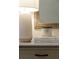 Elegant nightstand with lamp, candle, and books at 2601 County Line Nw Rd, Acworth, GA 30101