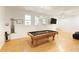 Game room with pool table, hardwood floors and large TV at 2601 County Line Nw Rd, Acworth, GA 30101