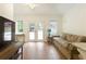 Bright living room with hardwood floors and french doors leading to patio at 2601 County Line Nw Rd, Acworth, GA 30101