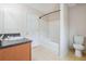 Bathroom with tub, toilet and wood vanity at 4029 Riverside Pkwy, Decatur, GA 30034
