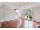Open living room with hardwood floors and large windows at 4029 Riverside Pkwy, Decatur, GA 30034