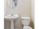 Small bathroom with pedestal sink and toilet at 4029 Riverside Pkwy, Decatur, GA 30034