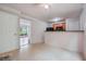 Kitchen with breakfast bar and view into living room at 4029 Riverside Pkwy, Decatur, GA 30034