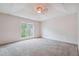 Spacious bedroom with carpeted floor and large window at 4029 Riverside Pkwy, Decatur, GA 30034