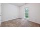 Bright bedroom with neutral carpeting and large window at 4029 Riverside Pkwy, Decatur, GA 30034