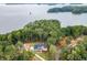 Aerial view of a house near the lake, showcasing waterfront property at 7620 Breeze Bay Rd, Cumming, GA 30041