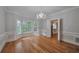 Formal dining room with hardwood floors and a chandelier, access to kitchen at 220 Fox Hunter Dr, Alpharetta, GA 30022