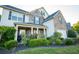 House exterior with stone and siding accents, manicured lawn at 1311 Cozy Cove Ln, Lawrenceville, GA 30045