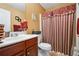 Clean bathroom with shower/tub combo, vanity, and toilet at 7110 Smithers Sw Way, South Fulton, GA 30331