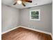 Bright bedroom with hardwood floors and a window offering natural light at 5720 Deerfield Trl, Atlanta, GA 30349