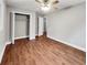 Bright bedroom with wood-look flooring and a large closet at 5720 Deerfield Trl, Atlanta, GA 30349