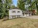 Charming ranch home with white exterior and landscaped yard at 5720 Deerfield Trl, Atlanta, GA 30349