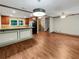 Bright dining area with hardwood floors and kitchen island at 5720 Deerfield Trl, Atlanta, GA 30349