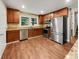 Modern kitchen with stainless steel appliances and granite counters at 5720 Deerfield Trl, Atlanta, GA 30349