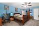 Spacious bedroom with a wooden sleigh bed and blue walls at 315 Watts Rd, Hiram, GA 30141