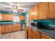 Bright kitchen with light wood cabinets, stainless steel appliances, and teal walls at 315 Watts Rd, Hiram, GA 30141