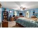 Large bedroom with a wooden sleigh bed and a workspace at 315 Watts Rd, Hiram, GA 30141