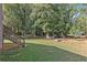 Large backyard with green grass and mature trees at 315 Watts Rd, Hiram, GA 30141