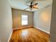 Bright bedroom with hardwood floors and ceiling fan at 410 S Fortune Way, Dallas, GA 30157