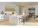 Modern kitchen featuring a large island, light wood cabinets, and marble countertops at 318 Sandy Springs Cir # 360, Sandy Springs, GA 30328