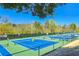 Outdoor tennis courts with players and ample space at 318 Sandy Springs Cir # 360, Sandy Springs, GA 30328