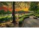 Riverfront property with a serene walkway and sunset view at 318 Sandy Springs Cir # 360, Sandy Springs, GA 30328