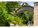 Entrance to Abernathy Greenway with stone archway and landscaping at 318 Sandy Springs Cir # 360, Sandy Springs, GA 30328