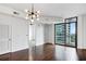 Open living room with hardwood floors and access to another room at 270 17Th Nw St # 1708, Atlanta, GA 30363