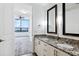 Double vanity bathroom with granite countertop and view of bedroom at 270 17Th Nw St # 1708, Atlanta, GA 30363