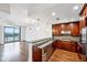 Modern kitchen with dark wood cabinets and granite counters at 270 17Th Nw St # 1708, Atlanta, GA 30363