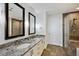 Modern bathroom with granite countertop, double sinks, and shower at 270 17Th Nw St # 1708, Atlanta, GA 30363