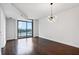 Bright living room with hardwood floors, large windows, and city views at 270 17Th Nw St # 1708, Atlanta, GA 30363