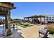 Relaxing rooftop patio with pergola, firepit, and seating at 270 17Th Nw St # 1708, Atlanta, GA 30363