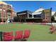 Outdoor seating area with red chairs overlooking Hobnob Tavern at 270 17Th Nw St # 1708, Atlanta, GA 30363
