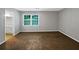 Main bedroom with brown carpet and view into the bathroom at 4762 Huntsman Bnd, Decatur, GA 30034