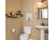 Stylish half bathroom with pedestal sink and decorative accents at 8104 Greens Mill Way, Loganville, GA 30052