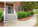 Steps leading to front door, with landscaping and walkway at 8104 Greens Mill Way, Loganville, GA 30052