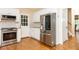 Modern kitchen with stainless steel appliances and hardwood floors at 8104 Greens Mill Way, Loganville, GA 30052