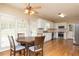 Kitchen with white cabinets, stainless steel appliances, and hardwood floors at 8104 Greens Mill Way, Loganville, GA 30052