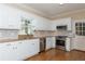 Modern kitchen with white cabinets, granite countertops and stainless steel appliances at 8104 Greens Mill Way, Loganville, GA 30052