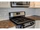 Stainless steel gas range and microwave in kitchen at 238 Walker Sw St # 32, Atlanta, GA 30313