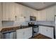 Modern kitchen with white cabinets, granite counters and stainless steel appliances at 238 Walker Sw St # 32, Atlanta, GA 30313