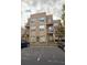 Tan 3-story building with balconies and parking at 238 Walker Sw St # 32, Atlanta, GA 30313