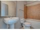 Bathroom with tub, toilet, sink and updated tile at 238 Walker Sw St # 32, Atlanta, GA 30313