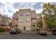 Tan 3-story building with balconies and parking at 238 Walker Sw St # 32, Atlanta, GA 30313